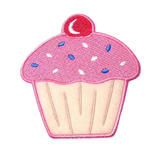 Custom cupcake-shaped embroidered patch with pink frosting, colorful sprinkles, and a stitched border.