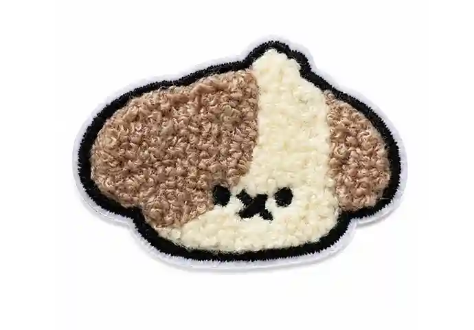 Custom chenille patch featuring a cute brown and cream puppy face with a black embroidered outline.