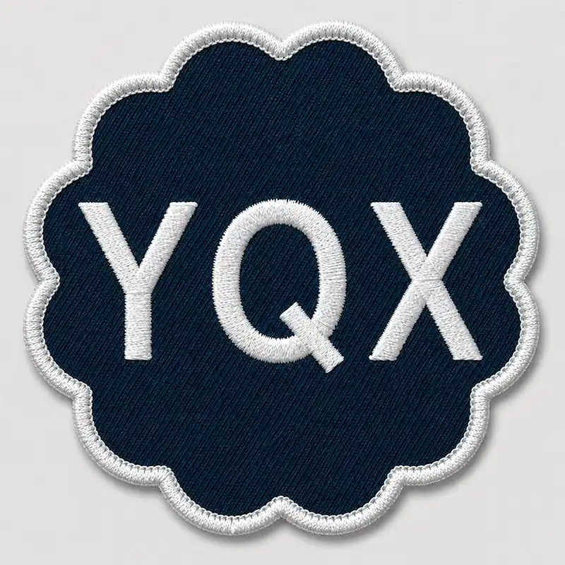 Front view of a custom shape embroidered patch with white lettering and a laser-cut scalloped edge.