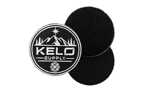 Embroidered patch with hook and loop backing for removable application on uniforms, bags, caps, or tactical-style products.